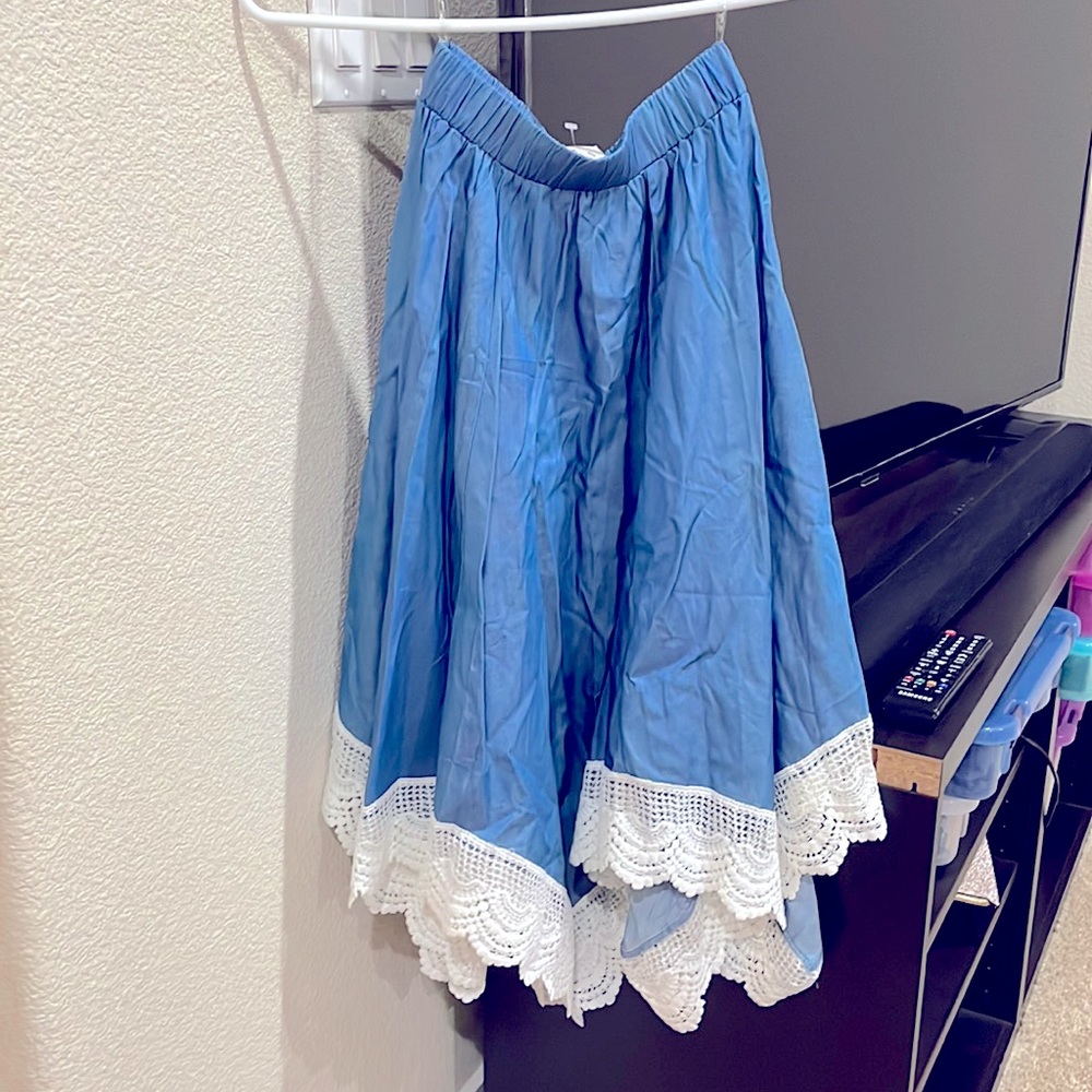 Asymmetrical skirt- blue with white lace embroidery.